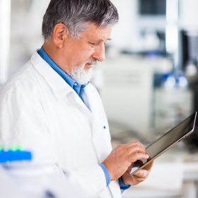 senior researcher with tablet